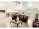 Spacious living room with open floor plan connecting to the kitchen and dining area at 7804 S 15Th Ave, Phoenix, AZ 85041