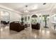 Bright and airy living room featuring tile floors, neutral walls, and large windows at 7804 S 15Th Ave, Phoenix, AZ 85041