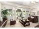 Spacious living room with recessed lights, large windows and comfortable seating at 7804 S 15Th Ave, Phoenix, AZ 85041
