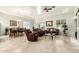 Open-concept living and dining area with tile flooring, comfortable furniture, and plenty of natural light at 7804 S 15Th Ave, Phoenix, AZ 85041