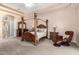 Beautiful main bedroom featuring a tray ceiling, cozy seating area, and ample closet space at 7804 S 15Th Ave, Phoenix, AZ 85041