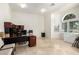 Bright home office space with tile floors, natural light and functional built-ins at 7804 S 15Th Ave, Phoenix, AZ 85041