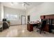 Spacious office area features tiled floors, lots of natural light, and flexible floor plan at 7804 S 15Th Ave, Phoenix, AZ 85041