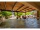 An amazing covered patio offers the perfect outdoor dining space and outdoor kitchen at 7804 S 15Th Ave, Phoenix, AZ 85041