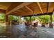 Inviting covered patio, perfect for outdoor dining and entertaining with outdoor kitchen at 7804 S 15Th Ave, Phoenix, AZ 85041