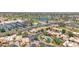 Community aerial view showcasing mature landscaping, swimming pool, and neighborhood layout at 7955 E Chaparral Rd # 73, Scottsdale, AZ 85250