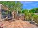 Outdoor space with built-in barbecue area, bench, hardscape and verdant foliage at 7955 E Chaparral Rd # 73, Scottsdale, AZ 85250