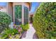 Charming exterior pathway with lush landscaping, flowering plants, and a tranquil garden setting at 7955 E Chaparral Rd # 73, Scottsdale, AZ 85250
