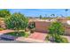 Lovely home with lush landscaping, a brick driveway, and an attached two-car garage at 7955 E Chaparral Rd # 73, Scottsdale, AZ 85250