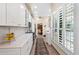 Modern kitchen with white cabinets, quartz countertops, and stainless steel appliances at 7955 E Chaparral Rd # 73, Scottsdale, AZ 85250