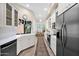 Well-lit kitchen with white cabinets, stainless steel appliances, and an island sink at 7955 E Chaparral Rd # 73, Scottsdale, AZ 85250
