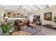 Comfortable living room with lots of seating, a TV, built-in cabinets, and warm neutral tones at 7955 E Chaparral Rd # 73, Scottsdale, AZ 85250