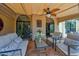 Inviting covered patio with comfortable seating, tile flooring, and a tranquil outdoor ambiance at 7955 E Chaparral Rd # 73, Scottsdale, AZ 85250