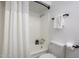 Bright bathroom featuring a shower-tub combination with modern fixtures and a neutral color scheme at 8055 E Thomas Rd # 104, Scottsdale, AZ 85251