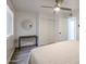 Well-lit bedroom featuring light wood floors, complemented by neutral decor and simple black furniture at 8055 E Thomas Rd # 104, Scottsdale, AZ 85251