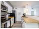 Efficient kitchen with stainless steel appliances and wood countertops at 8055 E Thomas Rd # 104, Scottsdale, AZ 85251