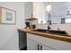 Kitchen sink with a wooden countertop and modern faucet at 8055 E Thomas Rd # 104, Scottsdale, AZ 85251