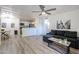 Bright living room featuring an open floor plan and a stylish ceiling fan at 8055 E Thomas Rd # 104, Scottsdale, AZ 85251