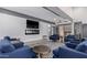 Community lounge area with comfortable seating, sleek fireplace, and modern decor at 8055 E Thomas Rd # 104, Scottsdale, AZ 85251