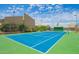Bright and spacious tennis court perfect for year-round play with lush green surroundings and attractive architecture at 8055 E Thomas Rd # 104, Scottsdale, AZ 85251