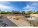 Open backyard featuring a concrete patio, block wall, and an in-ground pool under construction at 8156 E Questa Rd, Scottsdale, AZ 85255