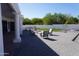 A stunning backyard featuring a modern outdoor fire pit and drought-tolerant landscaping at 8156 E Questa Rd, Scottsdale, AZ 85255