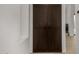 Elegant dark wood double doors provide a sophisticated and spacious closet entry at 8156 E Questa Rd, Scottsdale, AZ 85255