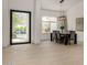 Bright dining room featuring stylish furnishings, a contemporary chandelier, and seamless flow with an open floor plan at 8156 E Questa Rd, Scottsdale, AZ 85255