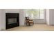 Cozy fireplace with decorative floral chair next to a window, allowing for a relaxing atmosphere at 8156 E Questa Rd, Scottsdale, AZ 85255