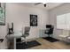 Bright home office with modern glass desks and stylish decor enhances productivity at 8156 E Questa Rd, Scottsdale, AZ 85255