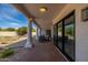 Covered patio with brick flooring offers a comfortable outdoor living space and backyard view at 8156 E Questa Rd, Scottsdale, AZ 85255