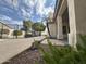 Expansive backyard showcasing the pool, patio, lush greenery, and views of the home's architecture at 854 W Mesquite St, Gilbert, AZ 85233
