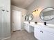 Bright bathroom featuring double sinks, round mirrors, and modern light fixtures at 854 W Mesquite St, Gilbert, AZ 85233