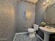 Stylish half bathroom featuring elegant pedestal sink, toilet, and decorative mirror at 854 W Mesquite St, Gilbert, AZ 85233