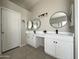 Bright bathroom with double sinks, tile floor, and modern light fixtures at 854 W Mesquite St, Gilbert, AZ 85233