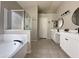 Bathroom featuring a separate shower and tub, tile floor, and double sinks at 854 W Mesquite St, Gilbert, AZ 85233