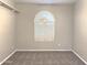 Neutral-toned bedroom featuring carpet, a ceiling fan, and a half-moon window with white blinds at 854 W Mesquite St, Gilbert, AZ 85233