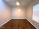 A bright bedroom featuring new hardwood floors, ceiling fan and a window with blinds at 854 W Mesquite St, Gilbert, AZ 85233