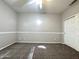 Neutral-toned bedroom featuring carpet, a ceiling fan, and a white panel door at 854 W Mesquite St, Gilbert, AZ 85233