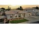 Charming single-story home with a two-car garage, a well-kept lawn, and tasteful landscaping at 854 W Mesquite St, Gilbert, AZ 85233
