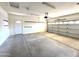Clean garage with painted concrete floor and new garage door at 854 W Mesquite St, Gilbert, AZ 85233