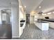 Bright and airy kitchen featuring white cabinets, dark countertops, and modern appliances at 854 W Mesquite St, Gilbert, AZ 85233