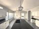 Bright, updated kitchen with a large island, modern pendant lighting, and tiled floors at 854 W Mesquite St, Gilbert, AZ 85233