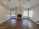 Spacious living room featuring a fireplace, wood floors and a high ceiling at 854 W Mesquite St, Gilbert, AZ 85233
