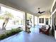 Inviting covered patio with comfortable seating, ceiling fan, and view of the sparkling pool at 854 W Mesquite St, Gilbert, AZ 85233