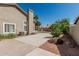 The backyard features a large concrete patio, lush landscaping, and a well-maintained lawn, perfect for outdoor activities at 921 N Oxford Ln, Chandler, AZ 85225