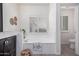 Bright bathroom featuring a soaking tub under a window and next to a closed toilet room at 921 N Oxford Ln, Chandler, AZ 85225