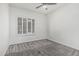 Bedroom features a large window with plantation shutters and neutral carpet floors at 921 N Oxford Ln, Chandler, AZ 85225