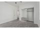 Bedroom featuring sliding closet doors and an ensuite bathroom with carpet floors at 921 N Oxford Ln, Chandler, AZ 85225