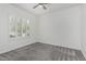 Bedroom features a large window with plantation shutters and neutral carpet floors at 921 N Oxford Ln, Chandler, AZ 85225